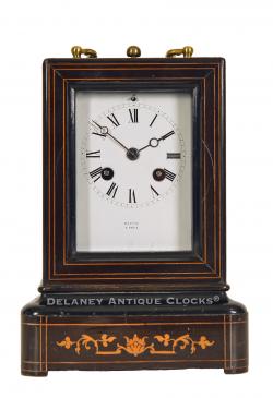 French-origin mantel clock. Marked "HATTON / A PARIS" on the dial and movement. A decorative inlaid lacquered case of diminutive scale. CCC-30.