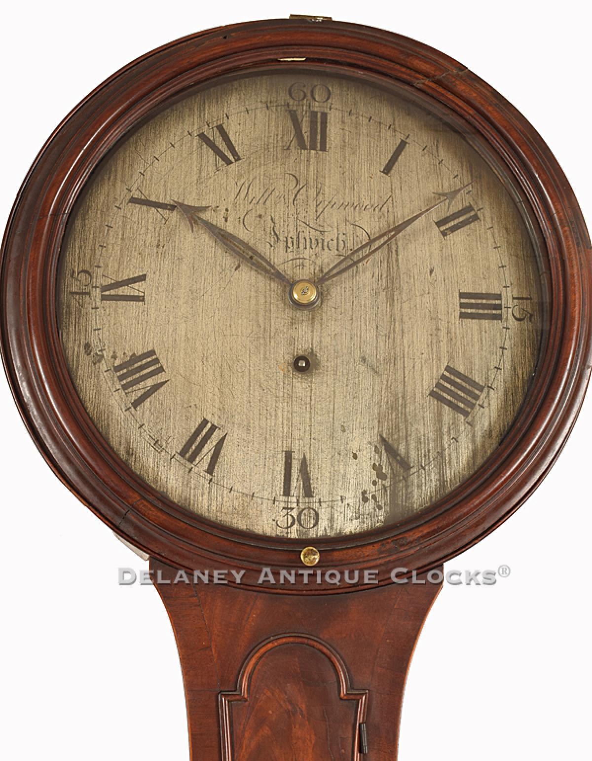 This highly figured "tear drop" style tavern clock was made by William Orpwood in Ipswich, England. 221151. Delaney Antique Clocks.