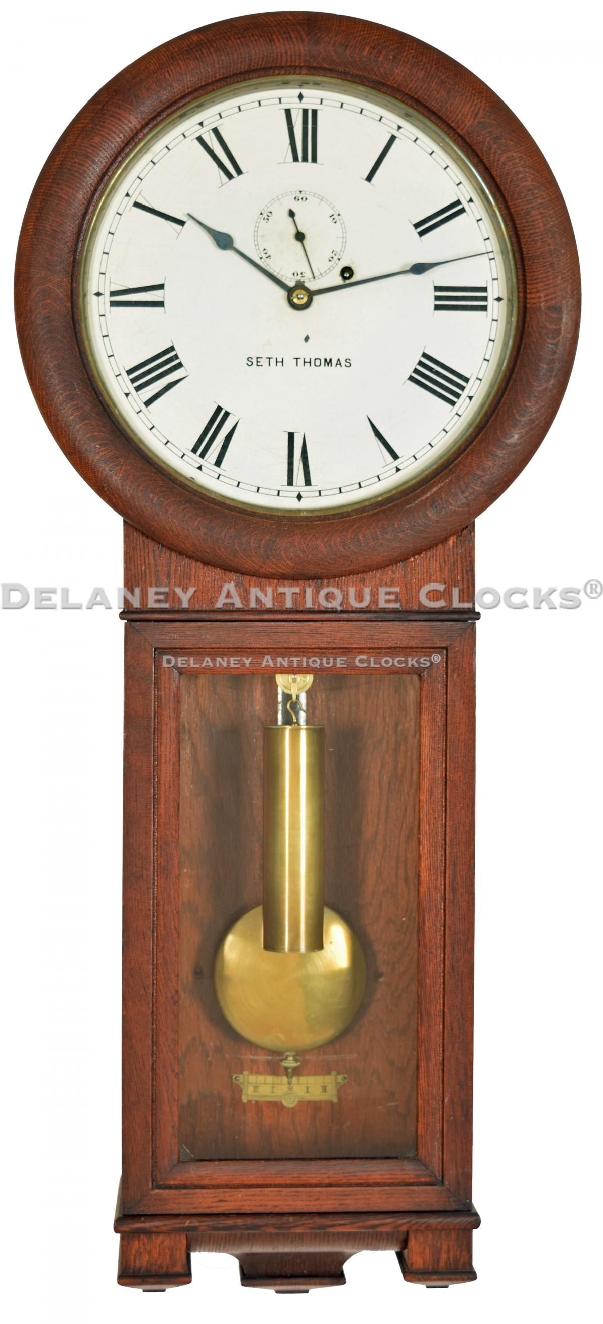 Seth Thomas Regulator No. 2. This is an oak case example. 222062. Delaney Antique Clocks.