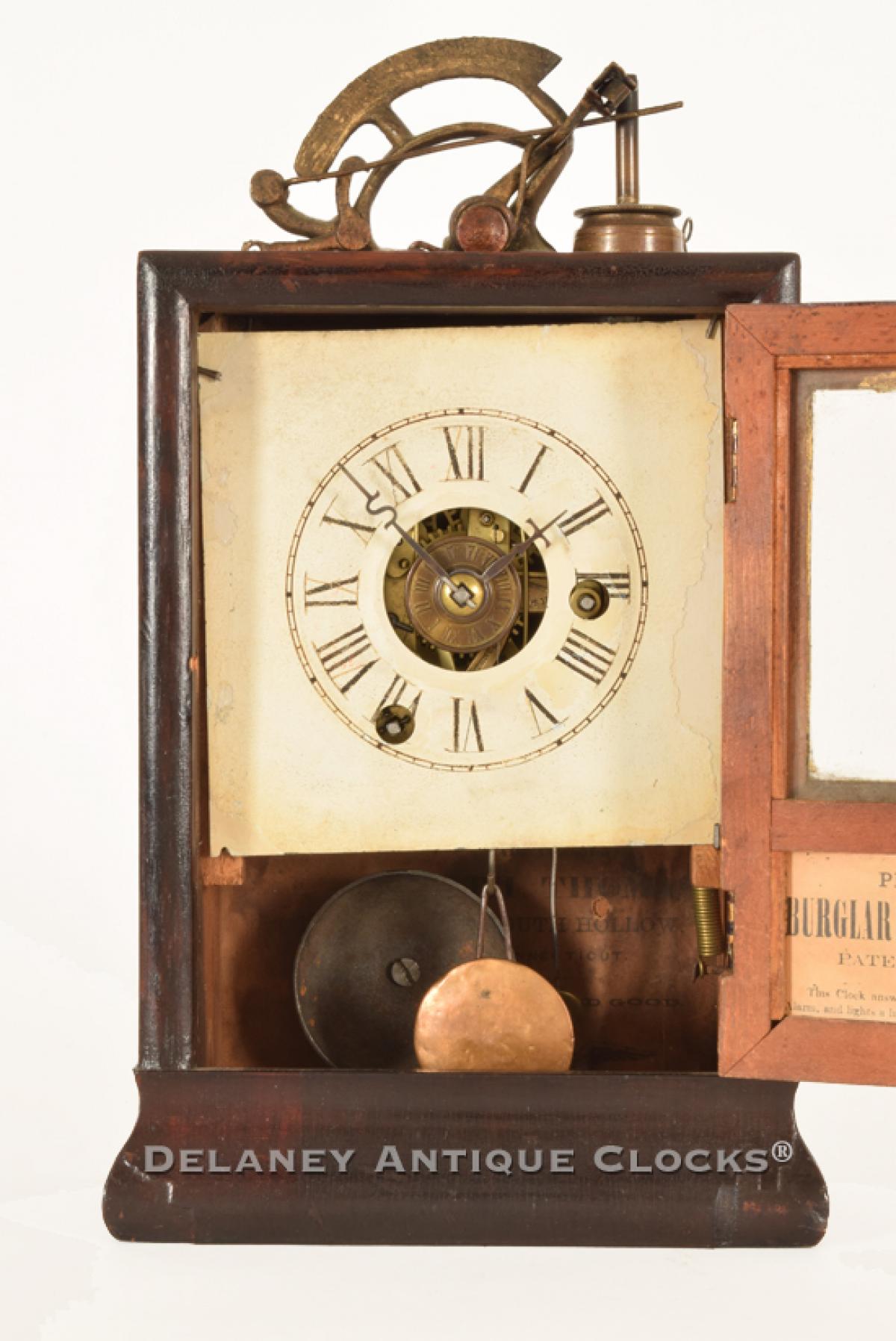 Seth Thomas. An Illuminating Alarm Clock. PROCTOR’S PATENT. BURGLAR AND FIRE-DETECTIVE CLOCK. PATENTED AUGUST 7, 1860. SS-10