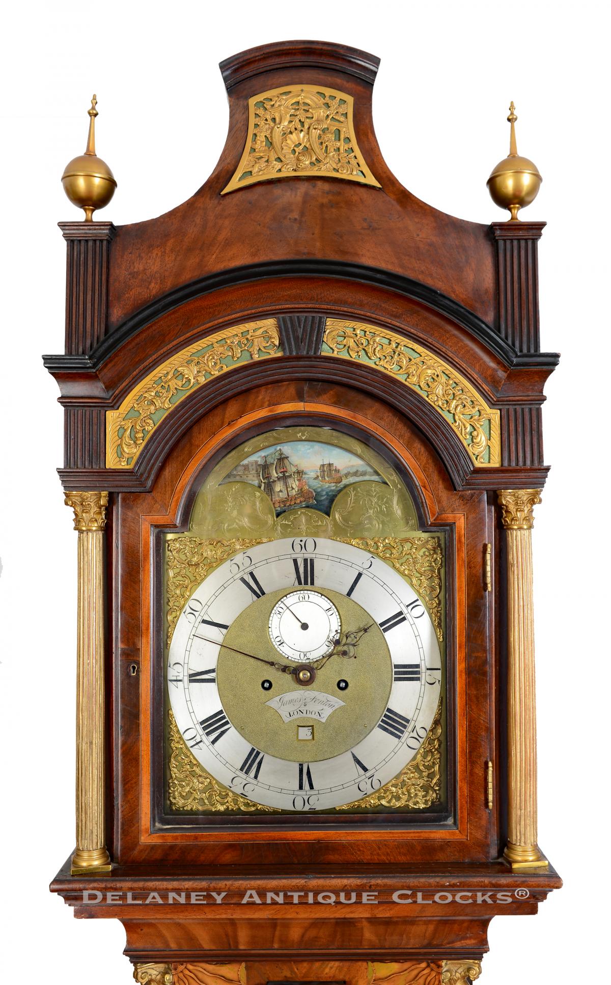 James Fenton, London inlaid mahogany long case clock with an arched dial and automated rocking ship display. 223333.