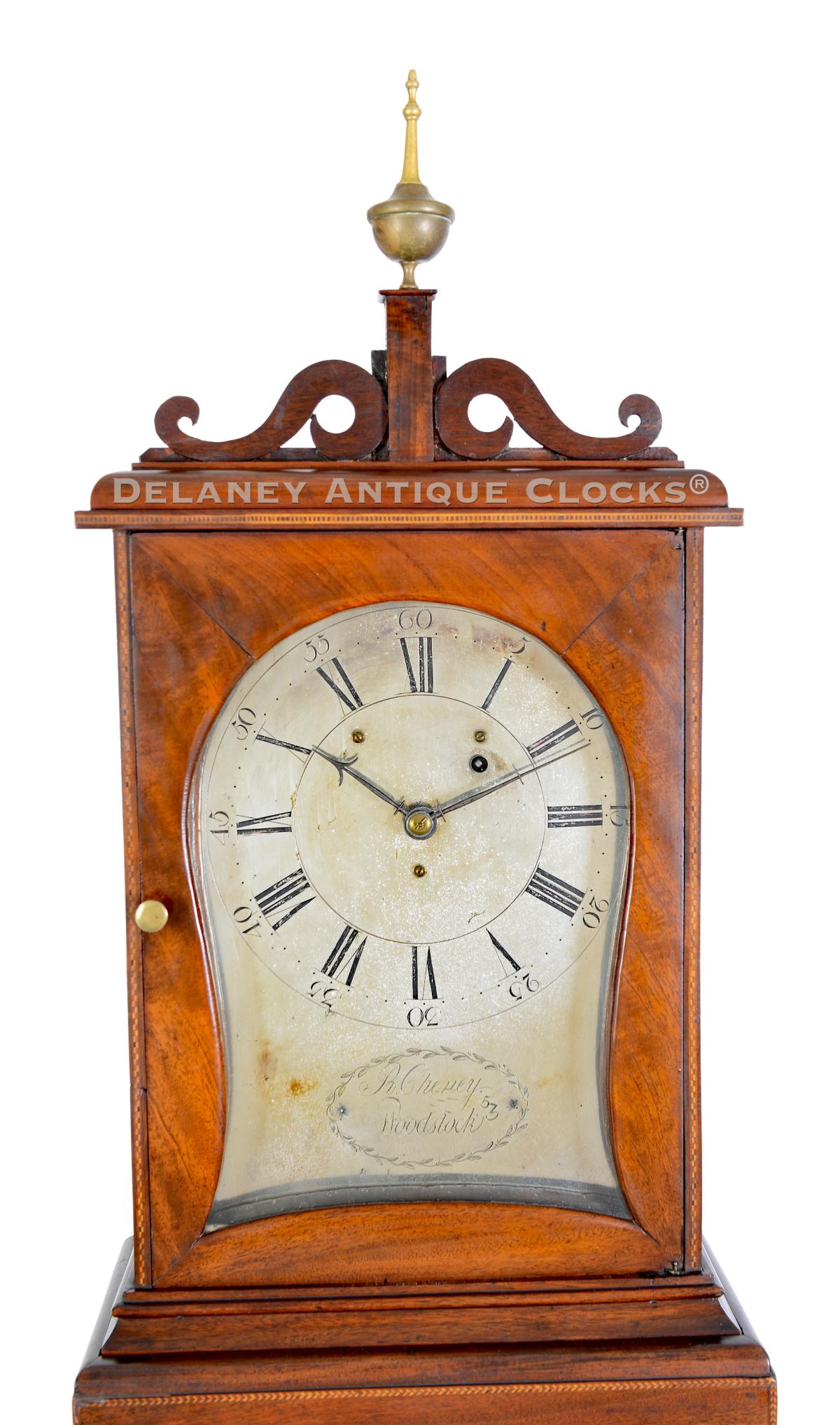 Russell Cheney of Woodstock, Vermont. This inlaid and cross-banded mahogany-cased Shelf Clock with a kidney-shaped dial is numbered 53. 224111.