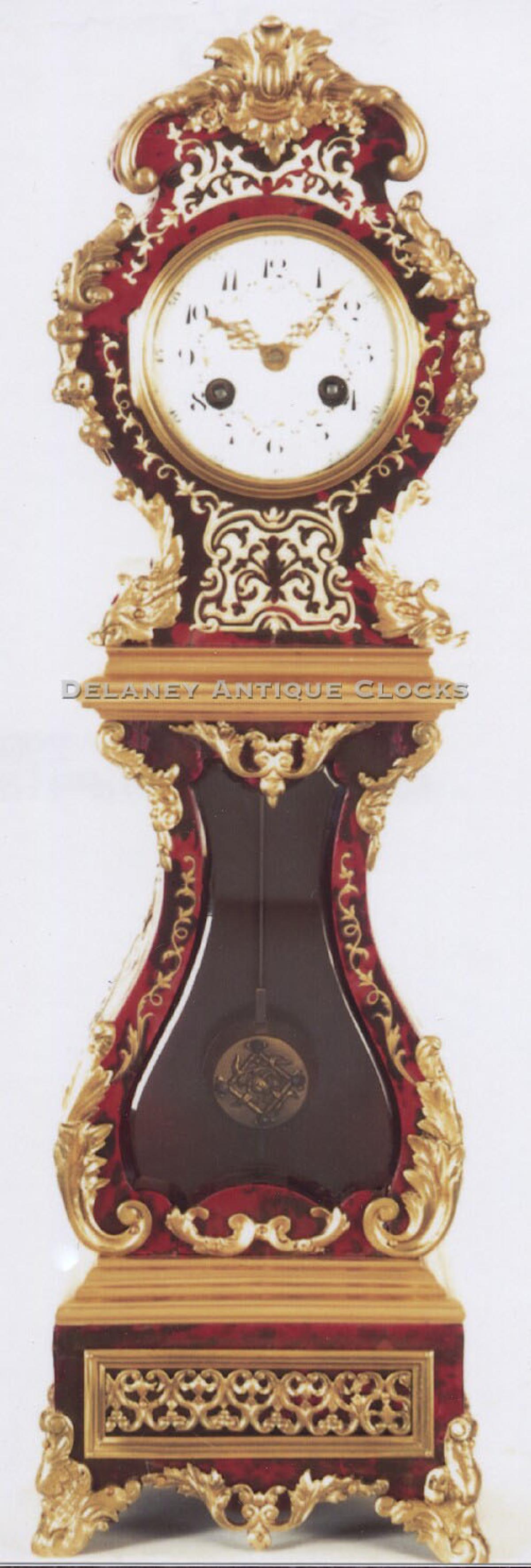 A miniature French made tall case clock. Tortoiseshell veneered case. 213067.