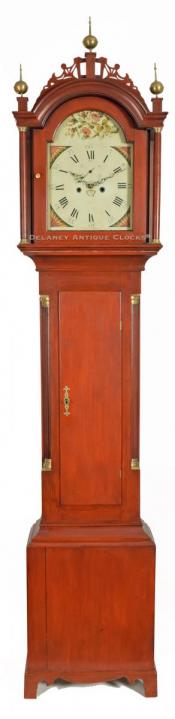 A central New England grandfather clock. This is a country form and it retains its original red wash finish. 218049