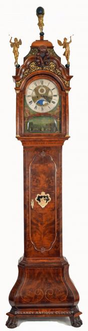 An impressive burl walnut long case clock with an automated brass dial signed "Jan Henkels - Amsterdam."  ZZ-10.