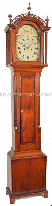 An unsigned cherry case grandfather clock cross-banded in mahogany. 25124.