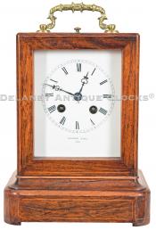 French-origin mantel clock. Marked "POTONIE PARIS" on the dial and movement. A decorative rosewood veneered case of diminutive scale. CCC-29.