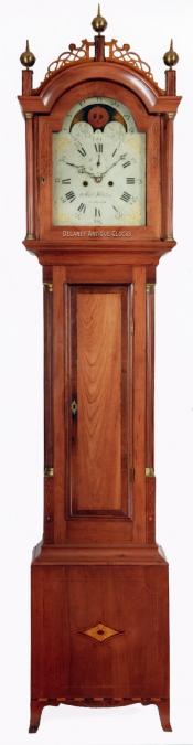 This is a finely inlaid cherry case tall clock made by Abel Hutchins of Concord, NH. Dated on the back of the dial, "Nov 28 1809." 217071. Delaney Antique Clocks.