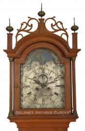 Daniel Burnap of East Windsor, CT. This cherry-cased tall clock features an engraved brass dial with a lunar calendar display. 223021. Delaney Antique Clocks.