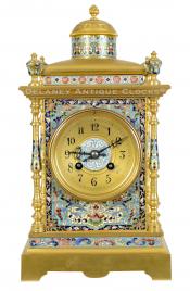 A gilt and champleve’ decorated mantel clock. 223311.