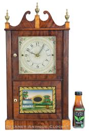 A Miniature Double Door Reeded Flat Column and Scroll Top Clock made by Norris North & Company in Torrington, Conn. 224069.