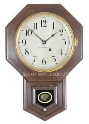 Seth Thomas 10-Inch Drop Octagon wall clock. A smaller school clock finished in a dark stain. 224101.