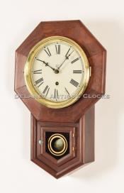 Waterbury Clock Company Drop Octagon wall clock. Rosewood case, 8 Inch dial. 215075.