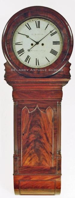 John Woolrich of Wolferhampton, England. This is a large wall clock in a mahogany case. FF-28.