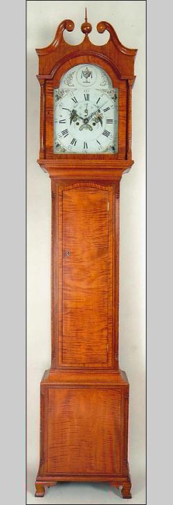 An unsigned tiger maple tall case clock. Great wood.