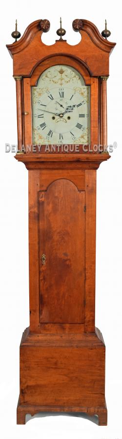 A birch case tall clock in its original red wash made in New Hampshire, Concord area. 217093.