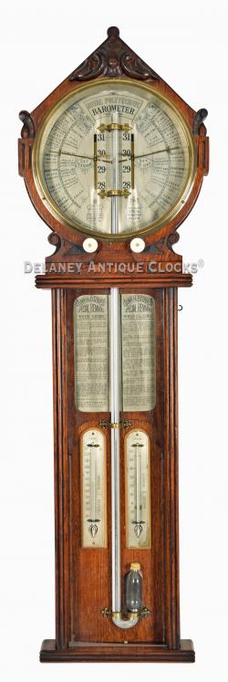 Admiral Fitzroy's Royal Polytechnic Barometer. "Joseph Davis & Co." This example is presented in a carved oak case of superb color. 222009