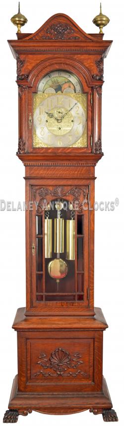 This oak case hall clock featuring a J. J. Elliott made London movement. 222042.