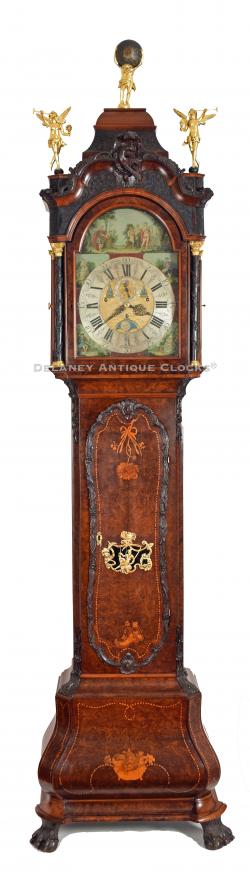 Jan Henkels – Amsterdam. An impressive burl walnut long case clock with a SEVEN Tune, three-train, Musical movement, and an automated brass and painted dial. CCC-22.