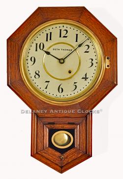 Seth Thomas 10 Inch Drop Octagon wall clock. A smaller school house clock in an oak case. 219024.