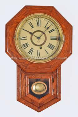 Ansonia Clock Co. 8-Inch Drop Octagon in oak. Wall clock. 219139.