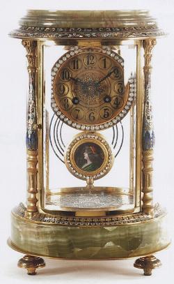 A French-made Onyx and Champleve Enamel decorated circular case Crystal Regulator mantel clock. 214072.