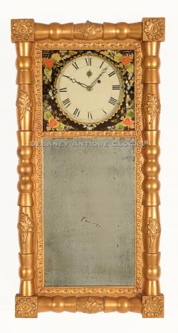 This decorative mirror clock is unsigned although it has a very distinctive movement which suggests the Maker was from Concord, Massachusetts. 221069.