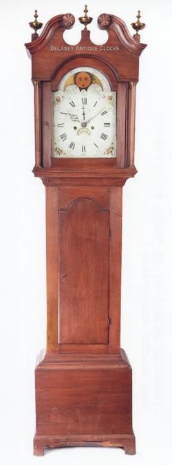 A maple case tall clock made in New Hampshire, Concord area. This is a country form. Inventory number 217084.