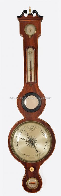 An inlaid mahogany case wheel barometer signed Oclee / Shefford. 220095.