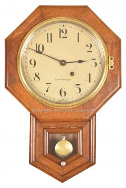 Seth Thomas 10 Inch Drop Octagon wall clock. A smaller school clock in an oak case. 222109.