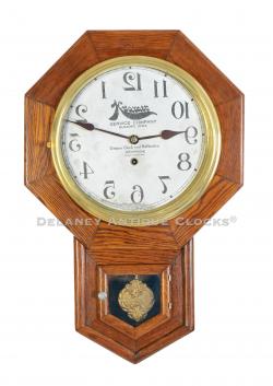 A Reverse Running Kramer Barber Shop clock made by the Waterbury Clock Co. of Waterbury, Connecticut. 223058.