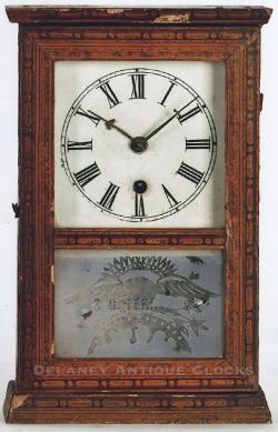 Silas B. Terry, Terryville, Conn., miniature shelf clock with 30 hour ladder time only, movement in a decorative paper covered case. TT-169.