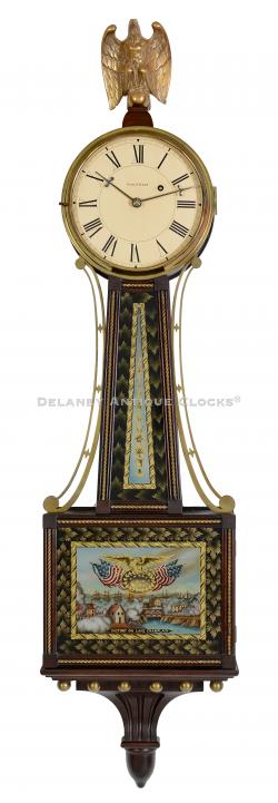 A wall timepiece or banjo clock made by the Waltham Watch Company of Waltham, Massachusetts. VICTORY ON LAKE CHAMPLAIN tablets. 223204.