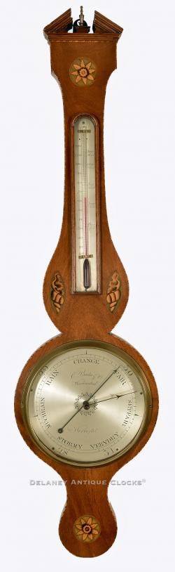 An inlaid mahogany case wheel barometer signed by the firm of C. Prada & C0., of Worcester, England. 220094