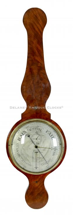 An English wheel barometer in a mahogany veneered case. 2190.