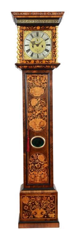 Robert Gregory, Londini Fecit. A floral marquetry decorated longcase clock features a rising hood. This clock dates to the late 17th century. EEE-11.