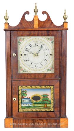 A Miniature Double Door Reeded Flat Column and Scroll Top Clock made by Norris North & Company in Torrington, Connecticut. This is one of the more colorful examples I have seen. 224069.