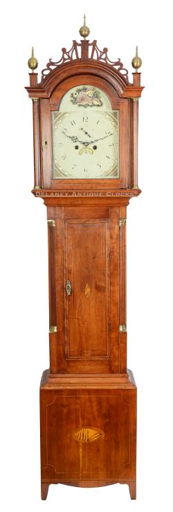 An inlaid cherry case tall clock, crafted in or near Concord, New Hampshire, with a distinct nautical theme, perfect for a sea lover. 223153.