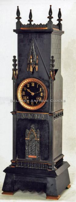 A French made mantel clock in the form of a gothic tower.