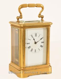 A miniature carriage clock of French origin. Shown here next to standard size example. RR26
