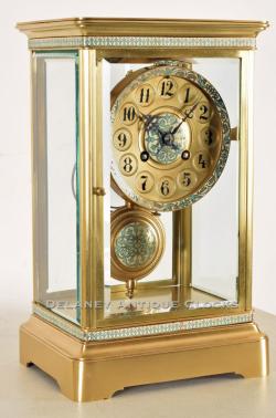 A French origin Crystal Regulator mantel clock decorated with champleve. 